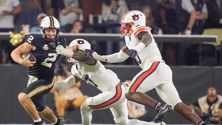 Vanderbilt quarterback Diego Pavia (2) is stopped by Auburn linebacker Xavier Atkins (17) and defensive end Amaris Williams (10) during the third quarter at FirstBank Stadium in Nashville, Tenn., Saturday, Nov. 8, 2025. Vanderbilt quarterback Diego Pavia (2) is stopped by Auburn linebacker Xavier Atkins (17) and defensive end Amaris Williams (10) during the third quarter at FirstBank Stadium in Nashville, Tenn., Saturday, Nov. 8, 2025.