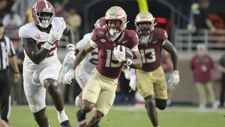 Aug 30, 2025; Tallahassee, Florida, USA; Florida State Seminoles wide receiver Micahi Danzy (19) runs with the ball against the Alabama Crimson Tide during the second half at Doak S. Campbell Stadium. Mandatory Credit: Melina Myers-Imagn Images