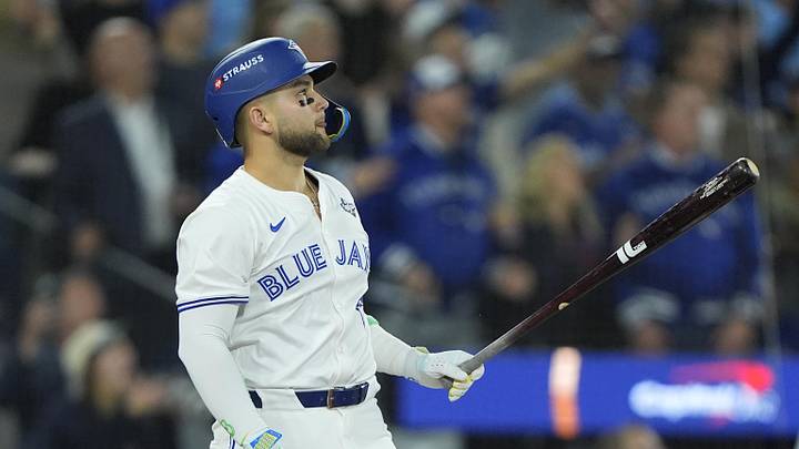 Nov 1, 2025; Toronto, Ontario, CAN; Toronto Blue Jays designated hitter Bo Bichette (11) hits a three-run home run against the Los Angeles Dodgers in the third inning during game seven of the 2025 MLB World Series at Rogers Centre. Mandatory Credit: John E. Sokolowski-Imagn Images