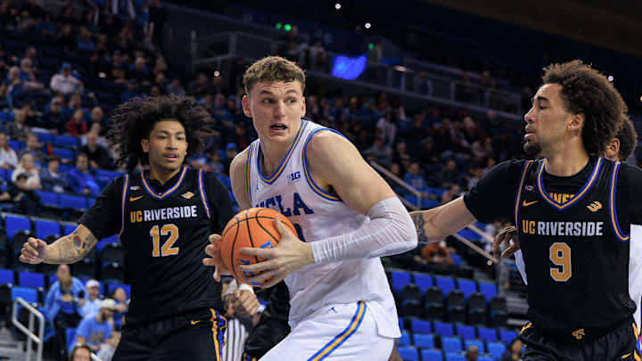 December 23, 2025, Westwood, California, USA: Tyler Bilodeau 34 of the UCLA Bruins is defended by Osiris Grady 9 and Andrew Henderson 12 of the UC Riverside Highlanders during a regular season NCAA, College League, USA basketball game on Tuesday December 23, 2025 at Pauley Pavilion in Westwood, California.