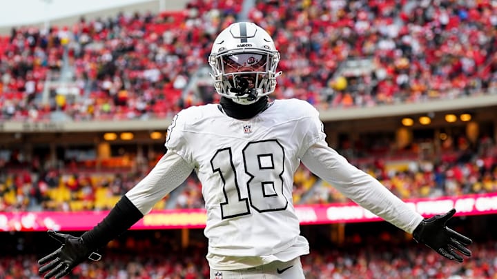 Dec 25, 2023; Kansas City, Missouri, USA; Las Vegas Raiders cornerback Jack Jones (18) interacts with the crowd after a play during the second half against the Kansas City Chiefs at GEHA Field at Arrowhead Stadium. Mandatory Credit: Jay Biggerstaff-Imagn Images