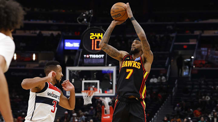 Dec 6, 2025; Washington, District of Columbia, USA; Atlanta Hawks guard Nickeil Alexander-Walker (7) shoots the ball over Washington Wizards guard CJ McCollum (3) in the second half at Capital One Arena. Mandatory Credit: Geoff Burke-Imagn Images