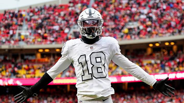 Dec 25, 2023; Kansas City, Missouri, USA; Las Vegas Raiders cornerback Jack Jones (18) interacts with the crowd after a play during the second half against the Kansas City Chiefs at GEHA Field at Arrowhead Stadium. Mandatory Credit: Jay Biggerstaff-USA TODAY Sports