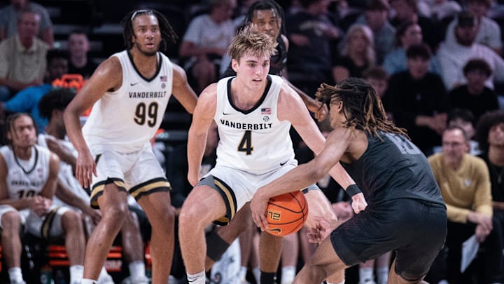 Vanderbilt Commodores guard Grant Huffman (4) guards Maryland-Eastern Shore Hawks guard Jose Cuello (10) during their game at Memorial Gym in Nashville, Tenn., Monday, Nov. 4, 2024.