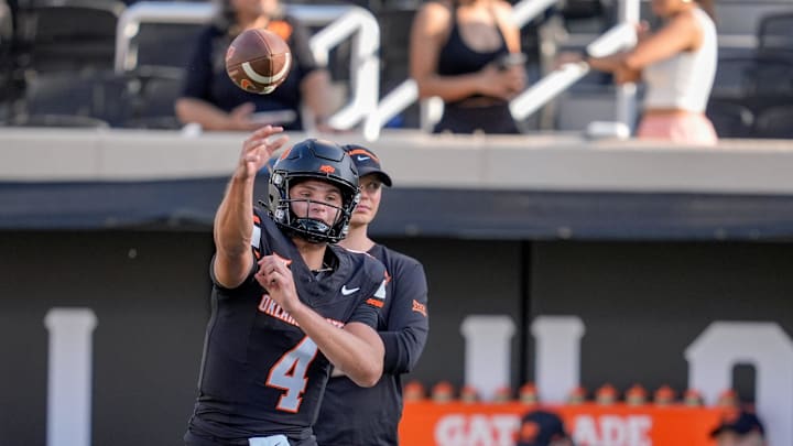 Oklahoma State quarterback Banks Bowen (4) warms up before an NCAA football game between Oklahoma State (OSU) and Tulsa at Boone Pickens Stadium in Stillwater, Okla., on Friday, Sept. 19, 2025.
