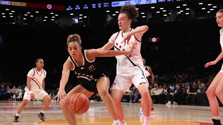 Apr 1, 2025; Brooklyn, NY, USA; McDonald's All American East guard Aaliyah Crump (23) and McDonald's All American West wing Grace Knox (23) compete for the ball during the second half of the game at Barclays Center. Mandatory Credit: Pamela Smith-Imagn Images