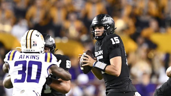 Oct 26, 2024; College Station, Texas, USA; Texas A&M Aggies quarterback Conner Weigman (15) looks to pass the ball during the second quarter against the LSU Tigers. The Aggies defeated the Tigers 38-23; at Kyle Field. Mandatory Credit: Maria Lysaker-Imagn Images.  