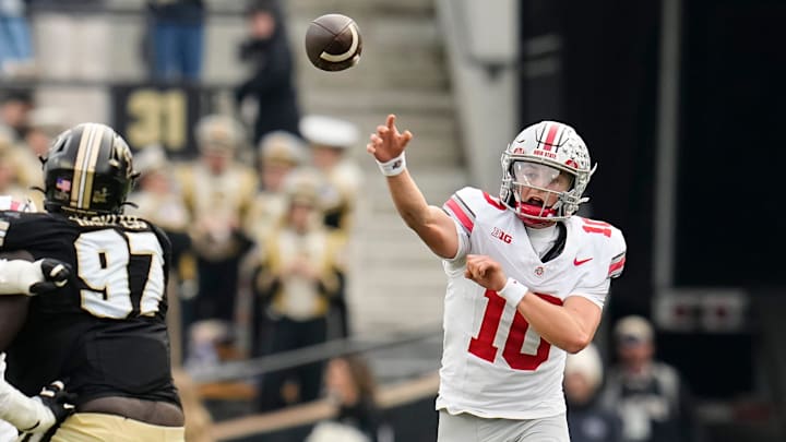 Ohio State Buckeyes quarterback Julian Sayin (10) throws over Purdue Boilermakers defensive lineman Jamarrion Harkless (97) during the NCAA football game at Ross-Ade Stadium in West Lafayette, Ind. on Nov. 8, 2025. Ohio State won 34-10.