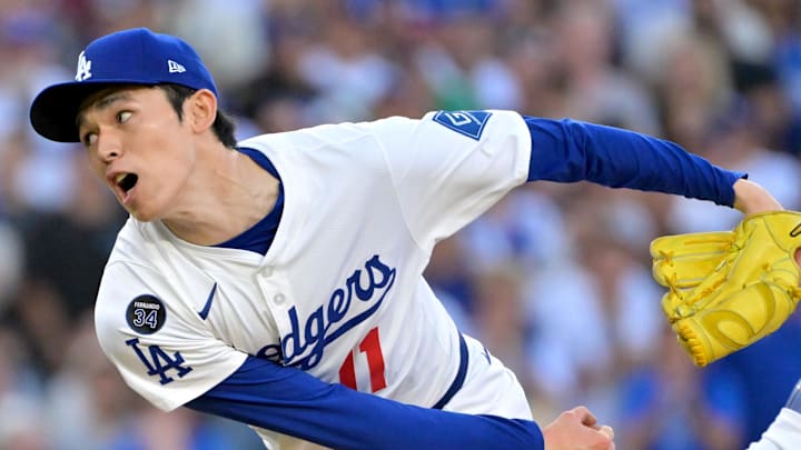Oct 9, 2025; Los Angeles, California, USA; Los Angeles Dodgers relief pitcher Roki Sasaki (11) delivers in the eighth inning of game four of the NLDS during the 2025 MLB playoffs against the Philadelphia Phillies at Dodger Stadium. Mandatory Credit: Jayne Kamin-Oncea-Imagn Images