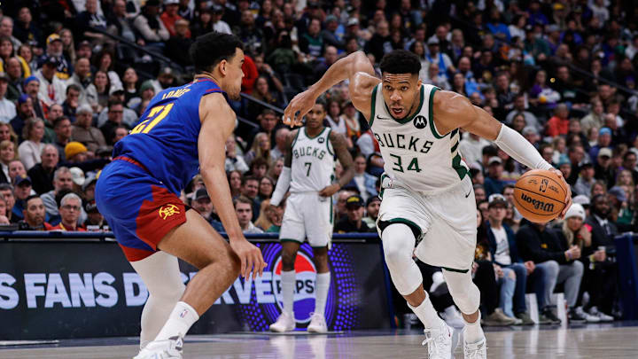 Jan 11, 2026; Denver, Colorado, USA; Milwaukee Bucks forward Giannis Antetokounmpo (34) drives to the basket against Denver Nuggets forward Spencer Jones (21) in the fourth quarter at Ball Arena. Mandatory Credit: Isaiah J. Downing-Imagn Images