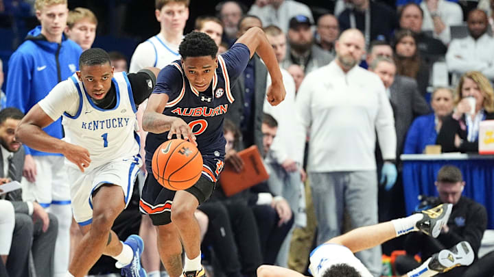 Auburn Tigers guard Tahaad Pettiford (0) steals the ball from Kentucky Wildcats guard Koby Brea (4), right, in the second half in SEC basketball at Rupp Arena Saturday afternoon in Lexington, Kentucky March 1, 2025