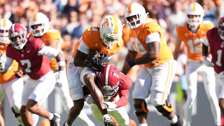Tennessee wide receiver Mike Matthews (4) is tackled by Alabama defensive back Red Morgan (6) during a game between Tennessee and Alabama in Neyland Stadium in Knoxville, Tenn., Oct. 17, 2026. Tennessee wide receiver Mike Matthews (4) is tackled by Alabama defensive back Red Morgan (6) during a game between Tennessee and Alabama in Neyland Stadium in Knoxville, Tenn., Oct. 17, 2026.
