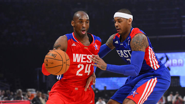 Feb 17, 2013; Houston, TX, USA; Western Conference guard Kobe Bryant (24) of the Los Angeles Lakers drives against Eastern Conference forward Carmelo Anthony (7) of the New York Knicks in the first quarter of the 2013 NBA all star game at the Toyota Center. Mandatory Credit: Bob Donnan-Imagn Images