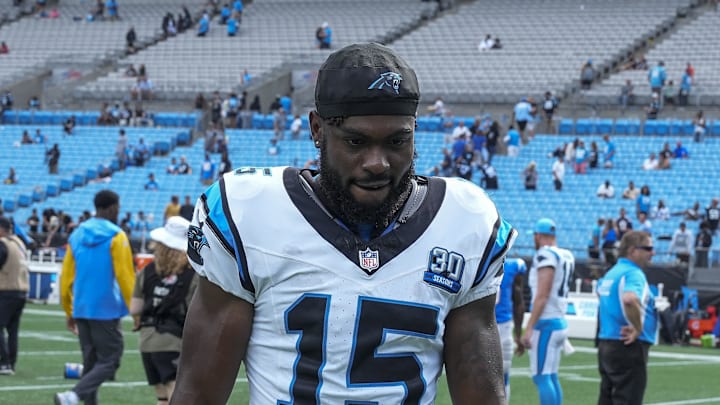 Sep 15, 2024; Charlotte, North Carolina, USA;  Carolina Panthers wide receiver Jonathan Mingo (15) walks off the field after the second half against the Los Angeles Chargers at Bank of America Stadium. Mandatory Credit: Jim Dedmon-Imagn Images