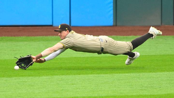 Aug 15, 2026; Cleveland, Ohio, USA; San Diego Padres left fielder Austin Hays (15) dives for the ball as it bounces off the grass in the first inning against the Cleveland Guardians at Progressive Field. Mandatory Credit: David Richard-Imagn Images Aug 15, 2026; Cleveland, Ohio, USA; San Diego Padres left fielder Austin Hays (15) dives for the ball as it bounces off the grass in the first inning against the Cleveland Guardians at Progressive Field. Mandatory Credit: David Richard-Imagn Images