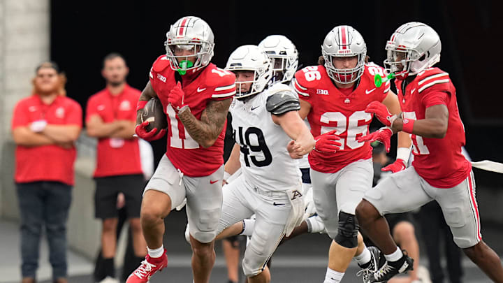 Aug 31, 2024; Columbus, OH, USA; Ohio State Buckeyes wide receiver Brandon Inniss (11) returns a punt during the second half of the NCAA football game against the Akron Zips at Ohio Stadium. Ohio State won 52-6.