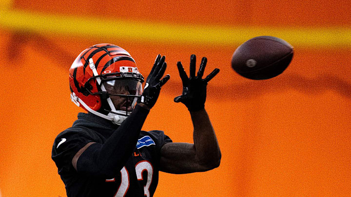 Cincinnati Bengals safety Dax Hill (23) catches a pass during an interception drill at Bengals spring practice at the IEL Indoor Facility in Cincinnati on Wednesday, June 12, 2024.