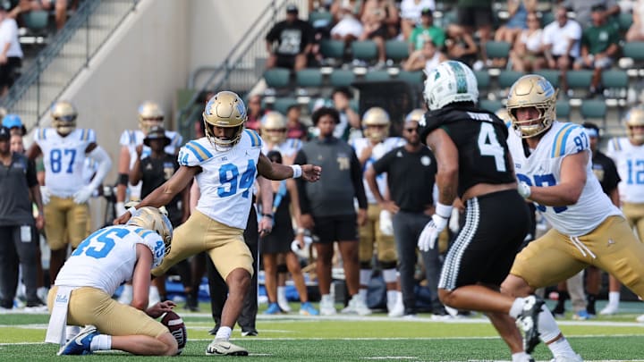 Aug 31, 2024; Honolulu, Hawaii, USA; UCLA Bruins place kicker Mateen Bhaghani (94) makes a field goal against the Hawaii Rainbow Warriors during the third quarter of an NCAA college football game against the UCLA Bruins at the Clarence T.C. Ching Athletics Complex. Mandatory Credit: Marco Garcia-Imagn Images Aug 31, 2024; Honolulu, Hawaii, USA; UCLA Bruins place kicker Mateen Bhaghani (94) makes a field goal against the Hawaii Rainbow Warriors during the third quarter of an NCAA college football game against the UCLA Bruins at the Clarence T.C. Ching Athletics Complex. Mandatory Credit: Marco Garcia-Imagn Images