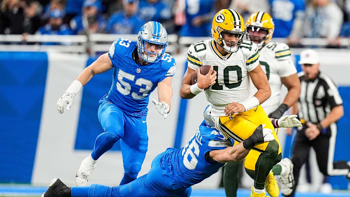 Detroit Lions linebacker Jack Campbell (46) tackles Green Bay Packers quarterback Jordan Love (10) during the first half at Ford Field in Detroit on Thursday, Dec. 5, 2024.