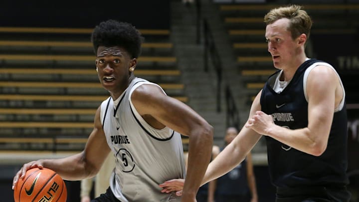 Purdue Boilermakers guard Myles Colvin (5) is guarded by Purdue Boilermakers guard Fletcher Loyer (2) 