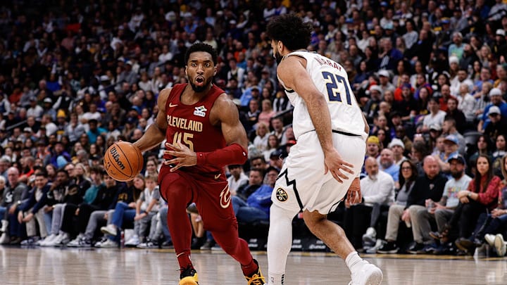 Dec 27, 2024; Denver, Colorado, USA; Cleveland Cavaliers guard Donovan Mitchell (45) controls the ball as Denver Nuggets guard Jamal Murray (27) guards in the first quarter at Ball Arena. Mandatory Credit: Isaiah J. Downing-Imagn Images Dec 27, 2024; Denver, Colorado, USA; Cleveland Cavaliers guard Donovan Mitchell (45) controls the ball as Denver Nuggets guard Jamal Murray (27) guards in the first quarter at Ball Arena. Mandatory Credit: Isaiah J. Downing-Imagn Images