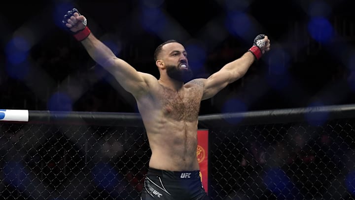 Jun 18, 2022; Austin, Texas, USA; Roman Dolidze (red gloves) celebrates after defeating Kyle Daukaus (not pictured)  during UFC Fight Night at Moody Center. Mandatory Credit: Scott Wachter-Imagn Images