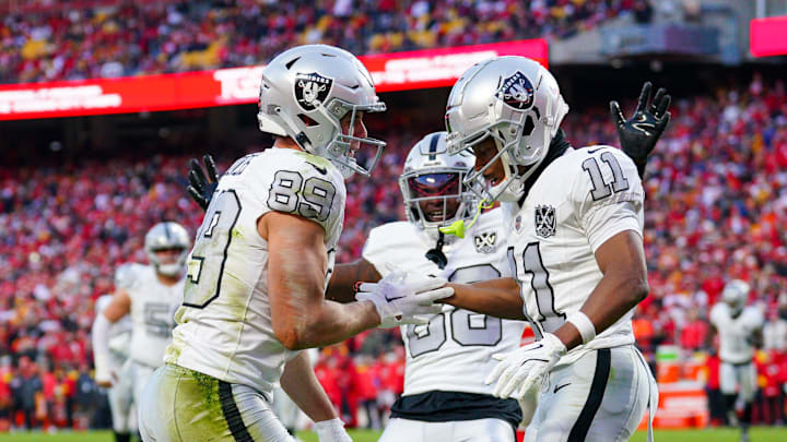 Nov 29, 2024; Kansas City, Missouri, USA; Las Vegas Raiders tight end Brock Bowers (89) celebrates with wide receiver Tre Tucker (11) after scoring against the Kansas City Chiefs during the second half at GEHA Field at Arrowhead Stadium. Mandatory Credit: Denny Medley-Imagn Images