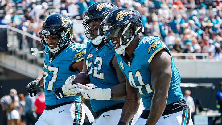 Jacksonville Jaguars defensive tackle Davon Hamilton (52) celebrates his fumble recovery with Jacksonville Jaguars defensive end Bryan Thomas Jr. (57), left and Jacksonville Jaguars defensive end Josh Hines-Allen (41) in the first quarter during an NFL football game at EverBank Stadium, Sunday, September 27, 2026, in Jacksonville, Fla. [Doug Engle/Florida Times-Union]