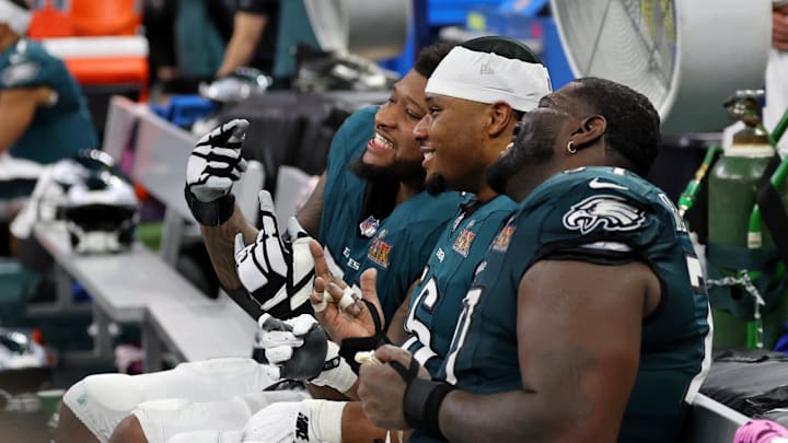 Feb 9, 2025; New Orleans, LA, USA; Philadelphia Eagles offensive tackle Fred Johnson (left) and guard Tyler Steen (center) react on the bench during the second half of Super Bowl LIX at Caesars Superdome. Mandatory Credit: Geoff Burke-Imagn Images