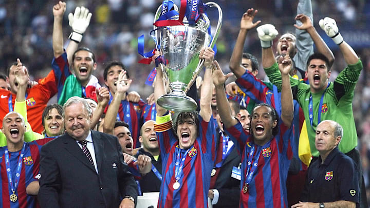 Barcelona's players hold the trophy afte