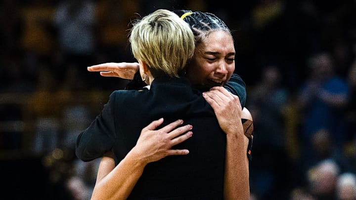 Iowa forward Hannah Stuelke (45) hugs Iowa head coach Jan Jensen as she comes off the court at the end of the basketball game against the Michigan Wolverines Feb. 22, 2026 at Carver-Hawkeye Arena in Iowa City, Iowa.