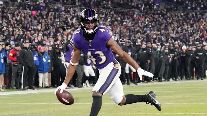 Jan 11, 2025; Baltimore, Maryland, USA; Baltimore Ravens running back Justice Hill (43) scores a touchdown against the Pittsburgh Steelers in the second quarter in an AFC wild card game at M&T Bank Stadium. Mandatory Credit: Mitch Stringer-Imagn Images