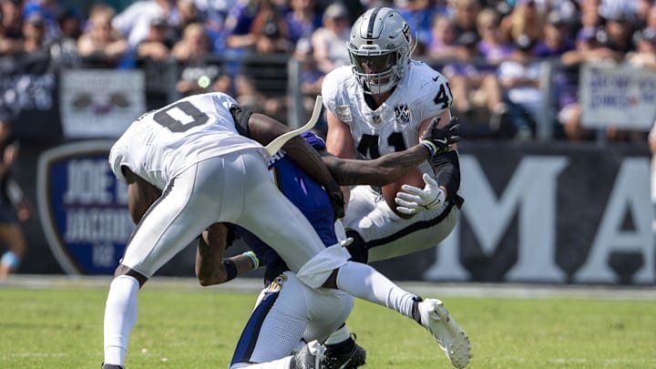 Sep 15, 2024; Baltimore, Maryland, USA; Las Vegas Raiders linebacker Robert Spillane (41) intercepts as pass intended for Baltimore Ravens wide receiver Rashod Bateman (7) during the second half at M&T Bank Stadium. Mandatory Credit: Tommy Gilligan-Imagn Images Sep 15, 2024; Baltimore, Maryland, USA; Las Vegas Raiders linebacker Robert Spillane (41) intercepts as pass intended for Baltimore Ravens wide receiver Rashod Bateman (7) during the second half at M&T Bank Stadium. Mandatory Credit: Tommy Gilligan-Imagn Images