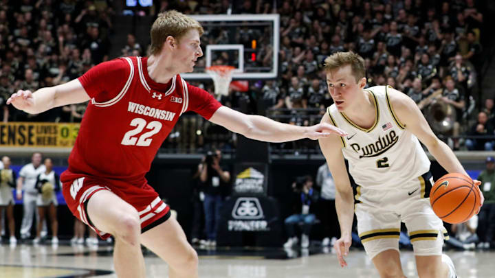 Wisconsin Badgers forward Steven Crowl (22) defends Purdue Boilermakers guard Fletcher Loyer (2) Saturday, Feb. 15, 2025, during the NCAA men’s basketball game at Mackey Arena in West Lafayette, Ind. Wisconsin Badgers won 94-84.