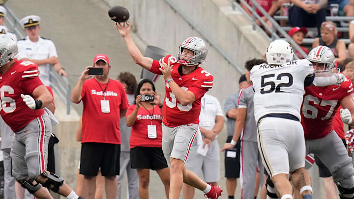 Aug 31, 2024; Columbus, OH, USA; Ohio State Buckeyes quarterback Devin Brown (33) throws during the second half of the NCAA football game against the Akron Zips at Ohio Stadium. Ohio State won 52-6.
