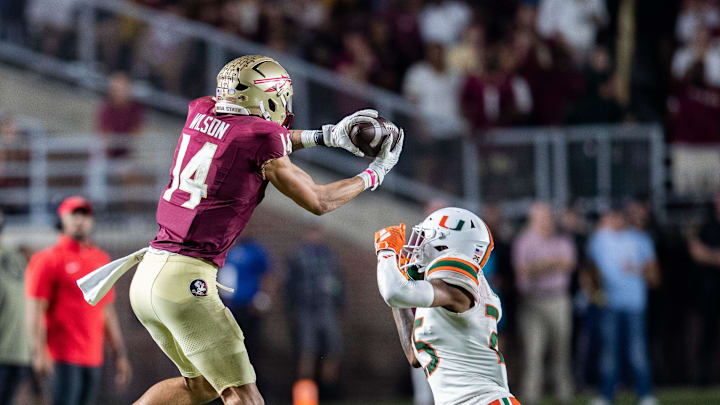 Florida State Seminoles wide receiver Johnny Wilson (14) catches a pass from Florida State Seminoles