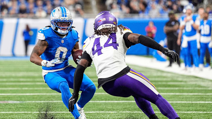 Detroit Lions running back Jahmyr Gibbs (0) runs against Minnesota Vikings safety Joshua Metellus (44) during the second half at Ford Field in Detroit on Sunday, November 2, 2025.