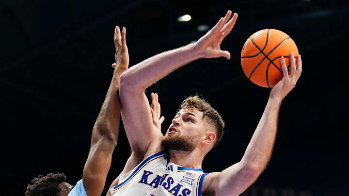 Nov 8, 2024; Lawrence, Kansas, USA; Kansas Jayhawks center Hunter Dickinson (1) shoots against North Carolina Tar Heels forward Jalen Washington (13) during the second half at Allen Fieldhouse. Mandatory Credit: Jay Biggerstaff-Imagn Images