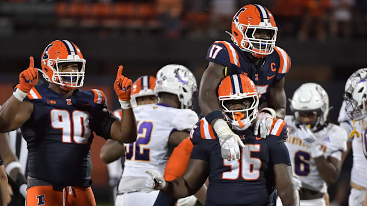 Aug 29, 2025; Champaign, Illinois, USA; Illinois Fighting Illini linebacker Gabe Jacas (17) jumps on teammate Illinois Fighting Illini defensive lineman Eli Coenen (96) after a sack on Western Illinois Leathernecks quarterback Chris Irvin (5) during the first half at Memorial Stadium. Mandatory Credit: Ron Johnson-Imagn Images Aug 29, 2025; Champaign, Illinois, USA; Illinois Fighting Illini linebacker Gabe Jacas (17) jumps on teammate Illinois Fighting Illini defensive lineman Eli Coenen (96) after a sack on Western Illinois Leathernecks quarterback Chris Irvin (5) during the first half at Memorial Stadium. Mandatory Credit: Ron Johnson-Imagn Images