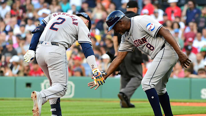Aug 10, 2024; Boston, Massachusetts, USA;  Houston Astros third baseman Alex Bregman (2) is congratulated by third base coach Gary Pettis (8) after hitting a home run during the seventh inning against the Boston Red Sox at Fenway Park. Mandatory Credit: Bob DeChiara-Imagn Images