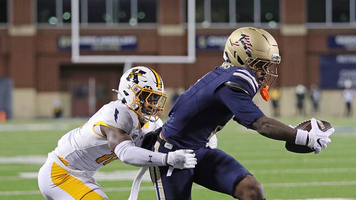 Akron Zips wide receiver Marcel Williams (2) scores a touchdown ahead of Kent State defensive back Terrell Miller (18) during the first half of the Wagon Wheel Rivalry football game at InfoCision Stadium, Nov. 11, 2025, in Akron, Ohio. Akron Zips wide receiver Marcel Williams (2) scores a touchdown ahead of Kent State defensive back Terrell Miller (18) during the first half of the Wagon Wheel Rivalry football game at InfoCision Stadium, Nov. 11, 2025, in Akron, Ohio.
