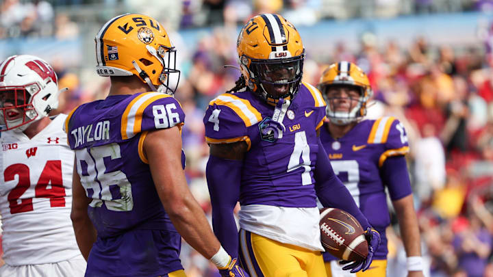 Jan 1, 2024; Tampa, FL, USA;  LSU Tigers running back John Emery Jr. (4) celebrates after scoring a