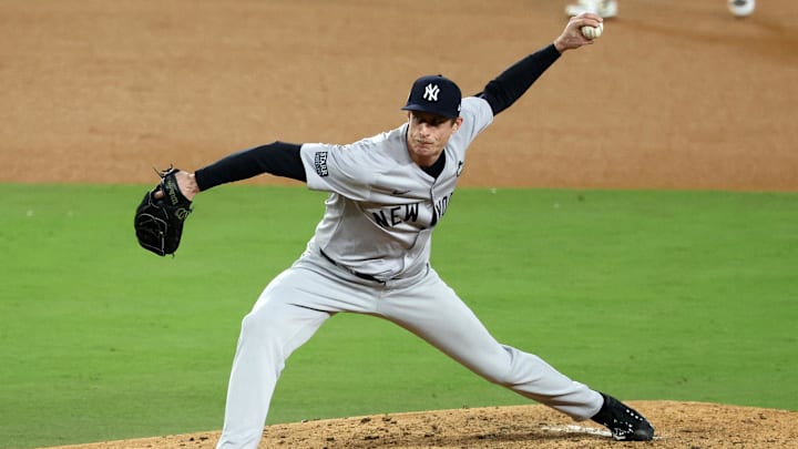 Oct 26, 2024; Los Angeles, California, USA; New York Yankees pitcher Tim Hill (54) throws a pitch against the Los Angeles Dodgers in the sixth inning for game two of the 2024 MLB World Series at Dodger Stadium. Mandatory Credit: Kiyoshi Mio-Imagn Images