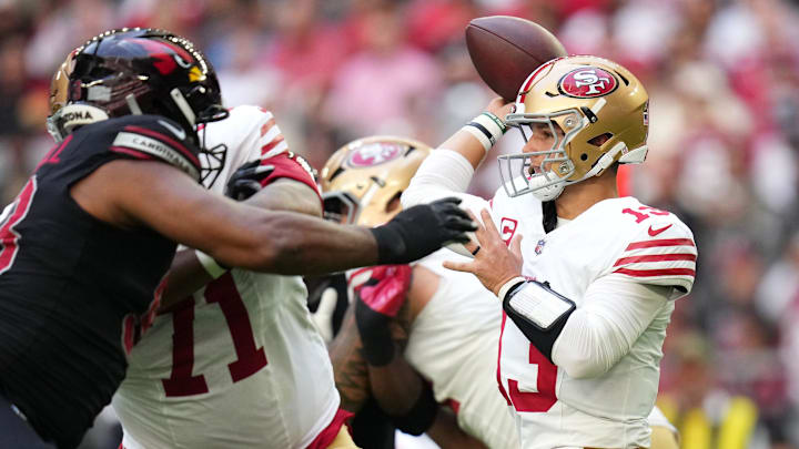 San Francisco 49ers quarterback Brock Purdy (13) throws the ball against the Arizona Cardinals at State Farm Stadium in Glendale on Nov. 16, 2025.