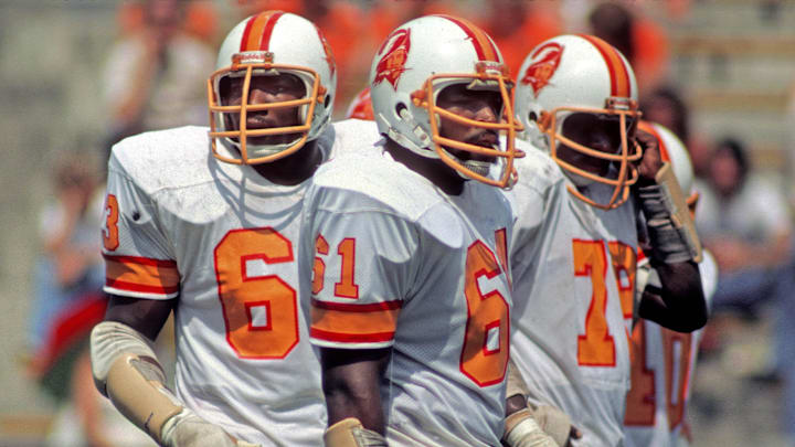 Tampa Bay Buccaneers defensive linemen Lee Roy Selmon, Dewey Selmon, and Council Rudolph during the 1976 season against the Buffalo Bills. Tampa Bay Buccaneers defensive linemen Lee Roy Selmon, Dewey Selmon, and Council Rudolph during the 1976 season against the Buffalo Bills.