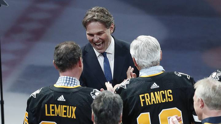 Feb 18, 2024; Pittsburgh, Pennsylvania, USA;  Pittsburgh Penguins former right wing Jaromir Jagr (middle) greets teammates Mario Lemieux and Ron Francis during a ceremony to retire the jersey number of Jaromir Jagr at PPG Paints Arena. The Penguins host the Los Angeles Kings after the ceremony. Mandatory Credit: Charles LeClaire-Imagn Images