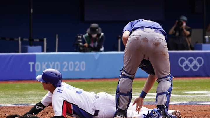Team South Korea infielder Hyeseong Kim (3) scores a run past Team Israel catcher Ryan Lavarnway (36) during the Tokyo 2020 Olympic Summer Games at Yokohama Baseball Stadium in 2021.