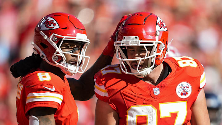 Nov 10, 2024; Kansas City, Missouri, USA; Kansas City Chiefs tight end Travis Kelce (87) is congratulated by wide receiver DeAndre Hopkins (8) after scoring a touchdown during the first half against the Denver Broncos at GEHA Field at Arrowhead Stadium. Mandatory Credit: Jay Biggerstaff-Imagn Images