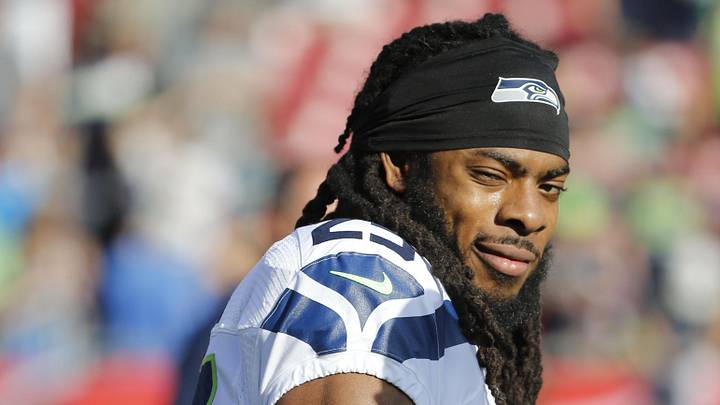Former Seattle Seahawks cornerback Richard Sherman (25) looks on 