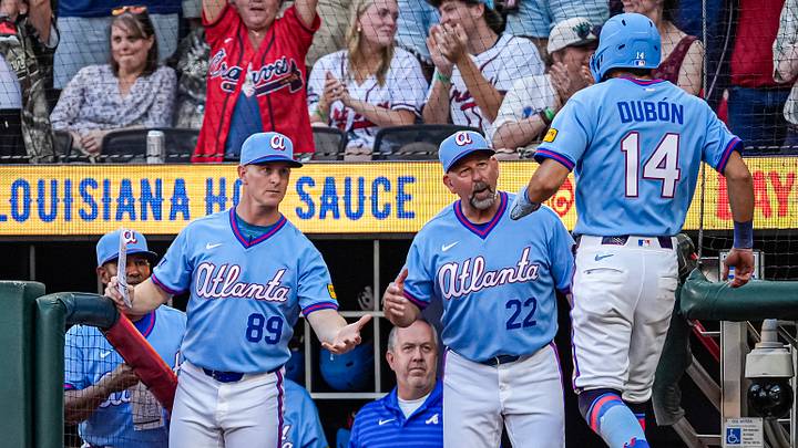 Aug 29, 2026; Cumberland, Georgia, USA; Atlanta Braves manager Walt Weiss (22) reacts with Mauricio Dubon (14) after Dubon scored a run against the Colorado Rockies during the eighth inning at Truist Park. Mandatory Credit: Dale Zanine-Imagn Images Aug 29, 2026; Cumberland, Georgia, USA; Atlanta Braves manager Walt Weiss (22) reacts with Mauricio Dubon (14) after Dubon scored a run against the Colorado Rockies during the eighth inning at Truist Park. Mandatory Credit: Dale Zanine-Imagn Images